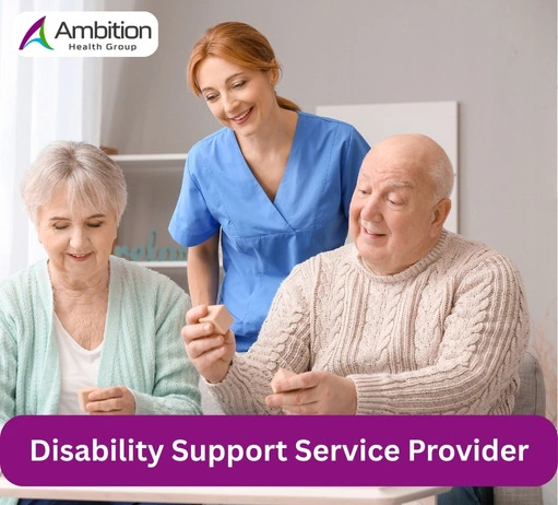 A caregiver in blue scrubs assists an elderly couple as they engage in an activity together, smiling and enjoying their time